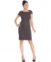 T Tahari makes a snakeskin print look sophisticated by adorning a sophisticated sheath silhouette with a tonal pattern.