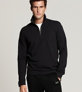 Long sleeve, French terry half zip with mockneck stand collar. Logo patch at bottom hem.