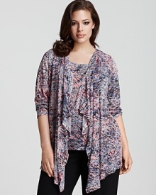 Rhinestone accents lend glamour to this flyaway cardigan by Calvin Klein.