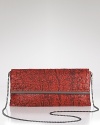 Evening style gets a touch exotic with this printed mesh clutch from BCBG Max Azria. In a bold hue, it's as striking as it is party-ready.