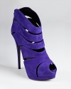 Bold in blue, Giuseppe Zanotti's Sharon platform booties make a statement with a towering heel and allover curvy cutouts.