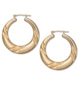 A simple twist is all it takes. Take any look up a notch with the subtle swirl and sparkling diamond accent of these 14k gold hoop earrings, by Signature Gold™. Approximate diameter: 1-1/8 inches.