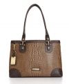 Creative contrast detailing elevates this chic croc tote into a new class of sophistication.