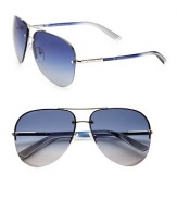 Double-bridge design and tubular stems with logo detail define this classic aviator style. Available in silver frames with blue gradient lenses.MetalLogo temple detail100% UV ProtectionMade in Italy