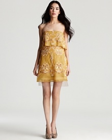 Elaborate embroidery lends a rich feel to this enchanting strapless dress from BCBGMAXAZRIA.