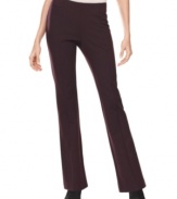 Chic seam design creates a streamlined effect on these petite bootcut-style trousers from INC.