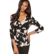 Flowers get a new, edgier look. The flattering wrap silhouette sets off the graphic look of the floral print perfectly!