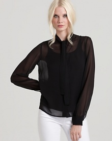 A sheer Rachel Zoe top ties at the neckline for vintage appeal, complementing workdays and weekends with luxurious, ladylike style.