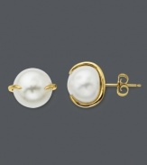 Studs with simple flair. These polished cultured freshwater pearl (2 x 10 mm) earrings feature a unique claw-style setting crafted in 14k gold. Approximate diameter: 1/2 inch.