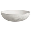 Edme low center bowl by Wedgwood. Wedgwood marks the 100th anniversary of its classic Edme collection with a refreshing update of its timeless pattern. A new antique white glaze enhances the elegant colannade embossment and laurel motif accent pieces. Sophisticated shapes and generously sized pieces make this pattern ideal for today's lifestyle.