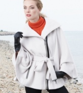 Calvin Klein gives a refined, minimalist look to outerwear with this chic cape. The faux-leather trim adds appealing edge.