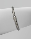 Diamond clasp accents sterling silver and 18K white gold chain bracelet. Pavé diamond, 0.17 tcw Push button close 7½ long Hand made in Bali