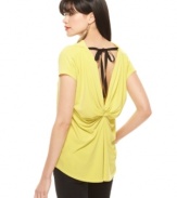 A dramatically draped back with ribbon tie adds eye-catching appeal to this Rachel Rachel Roy The Mariposa top -- perfectly paired ultra-sleek skinny jeans for a night out!