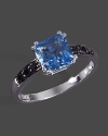 Black diamonds accent a faceted blue topaz set in 14K white gold.