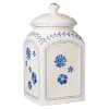 Crafted in premium porcelain for a traditional shape and patterned with a simple blue flower design, this large canister fits seamlessly into your collection and adds rustic charm.