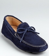 Treat your feet to this luxe suede loafer, finished with a stitched moc toe and tie detail at the tongue.