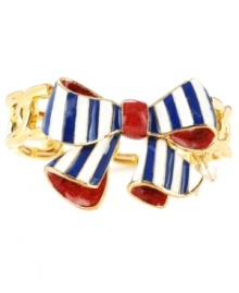 Wrap your wrists for a polished, put-together look. Betsey Johnson's adorable ribbon bracelet is crafted in gold-plated mixed metal with a blue, white and red enamel striped design. Approximate diameter: 2-1/4 inches.