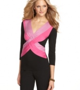 Brighten up with Cable & Gauge's twist-front top! The bold color pops against a background of flattering black.