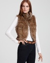 Wrap yourself in trend-right opulence with this Style Portfolio faux fur vest, boasting a sculpted cutaway hem and chic funnel collar.