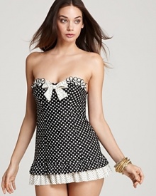 Put on Betsey Johnson's polka dot print swim dress for a beautiful bombshell silhouette. Glitzy bangles complete the glamorous look.