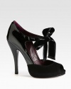 A large velvet bow with ribbon trim defines this suede and patent leather peep toe pump. Patent leather heel, 5 (125mm)Suede-covered platform, ½ (15mm)Compares to a 4½ heel (115mm)Patent leather and suede upper with velvet ribbon-trim bowPeep toeSelf tie bowLeather lining and solePadded insoleMade in Italy