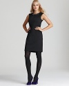 The go-to sheath silhouette gets a trend-right revamp with a shimmering embellished neckline on this T Tahari dress.