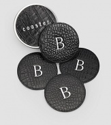 Water-treated coasters are crafted by hand in croco-embossed leather with non-skid bottoms to keep drinks in place and furniture safe. Set of four coasters arrive in a coordinating leather box for presentation and storage. Set of 4 4 diam. Made USA FOR PERSONALIZATION Select a quantity, then scroll down and click on PERSONALIZE & ADD TO BAG to choose and preview your personalization options. Please allow 1 week for delivery.