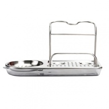 The OXO Stainless Steel Sink Organizer helps keep sink area neat and organized. Slim design fits in tight spaces and won't hog counter space. Features separate areas for long-handled brushes, palm brushes, pump dispensers and a sponge. Perforated base keeps sponges and tools dry; drip tray is removable for cleaning.