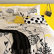 Whimsical, embroidered songbirds in pop yellow and botanical silhouettes against the bold contrast of black and white, our Anis collection brings the modern movement of flat art into the bedroom. Set includes duvet cover and two shams; Twin set has one sham. Duvet cover features button closure; Shams feature envelope closure. Machine wash.