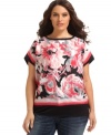 A blast of blossoms lighten up AGB's short sleeve plus size top, punctuated by a banded hem. (Clearance)