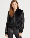 Luxe rabbit fur paneling adds a primal touch to this lustrous leather jacket with rib-knit trim. Ribbed collarDyed rabbit fur panelsLong sleeves with rib-knit cuffsFront zipperDyed rabbit fur backAbout 22 from shoulder to hemLeather with dyed rabbit fur trimDry clean with leather specialistImportedFur origin: ChinaModel shown is 5'10 (177cm) wearing US size Small.