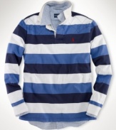 A long-sleeved striped rugby shirt is cut for a trim, modern fit from rustic utility cotton with a lightly filled diamond-quilted yoke for an athletic appeal.