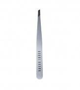 Keep brows groomed with this deluxe tweezer, crafted by Rubis of Switzerland. In stainless steel, this slant-tip instrument is considered the finest on the market. Comes with a rubber cap to protect the precision tip. 