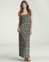 A graphic, eclectic print adds worldly flavor to this Velvet by Graham & Spencer strapless maxi dress.