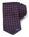 From Burberry comes a classic tie, showcasing a timeless neat and fancy pattern in burgundy.