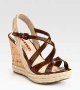 Leather criss-cross design with an espadrille slingback and cork wedge. Cork and hemp wedge, 4 (100mm)Cork and hemp platform, 1 (25mm)Compares to a 3 heel (75mm)Leather and hemp upperLeather liningRubber solePadded insoleImported