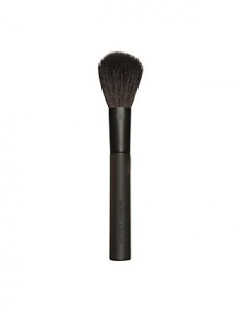 An essential accessory to any makeup wardrobe, the blush brush is designed with tapered bristles that allow you to dust on the perfect amount of makeup. Leaves a beautifully even, polished finish. Rounded edges caress the complexion with softness. 