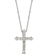 Sparkling and resplendent, this beautiful cross pendant features round-cut diamonds (1/4 ct. t.w.) set in 14k white gold. Approximate length: 16 inches. Approximate drop: 3/4 inches.