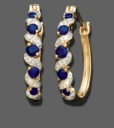 Sultry round-cut sapphire (5/8 ct. t.w.) cascades down these hoop earrings featuring diamond accents in 18k gold over sterling silver. Approximate drop: 3/4 inch. Approximate diameter: 1/2 inch.