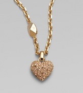 Be brilliant in this dazzling crystal encrusted heart pendant on a logo accented link chain. Palladium plated or goldtoneCrystalsLength, about 14Pendant size, about ½Spring ring closureImported