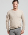 Luxurious cashmere and a classic silhouette make this cozy cashmere sweater this season's must-have item.