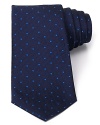 A brilliant design, from the strikingly rich color to the ingenious and unique craftsmanship of Turnbull & Asser, this classic tie features a polka dot pattern with a herringbone ground for a dynamic accent to your dress shirting.