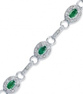 Enviable sparkle that everyone will want to get their hands on. This glam tennis bracelet highlights oval-cut emeralds (2 ct. t.w.) and round-cut diamonds (1/4 ct. t.w.) in sterling silver. Approximate length: 7-1/4 inches.