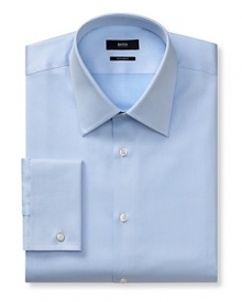 Slightly trimmer than classic fit, button front long-sleeved shirt. Voluminous Kent collar. French cuffs. Flat back yoke with no pleats. Clean front, no pocket. Rounded hem. Textured solid.