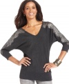 AGB gives this dolman sweater a feminine finish with sheer lace insets at the sleeves.