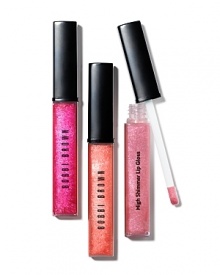 Bobbi's new lip gloss combines gorgeous, light-catching shimmer with lasting, non-sticky shine. Made with fine pearls and clear pigments, High Shimmer Lip Gloss stays color-true and gives lips beautiful, brilliant dimension. Plus it's enriched with emollients and Vitamins C and E to moisturize, condition and protect lips, so they feel as good as they look. Whether you wear it on its own or on top of your favorite Lip Color, the new tapered applicator lets you apply it like a pro.