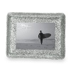 A unique treatment of hand-hammering on top of a cast surface gives this photo frame a unique look. For a beautiful presentation of your most cherished photo.