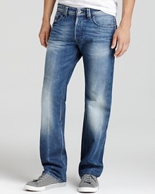 Suave straight leg jeans by Diesel featuring distressing and signature stitching on the back pockets.