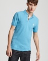 The classic fit polo from Burberry, tastefully accented with a check-lined button placket and embroidered logo.