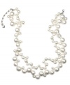 Perfectly polished. You'll look lovely and ladylike in this elegant necklace from AK Anne Klein. Embellished with glass pearls, it's set in silver tone mixed metal and features a double-row silhouette. Approximate length: 17 inches + 2-inch extender.